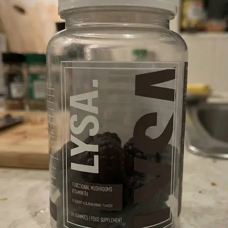 A jar of Lysa Wellness gummies on a kitchen worktop