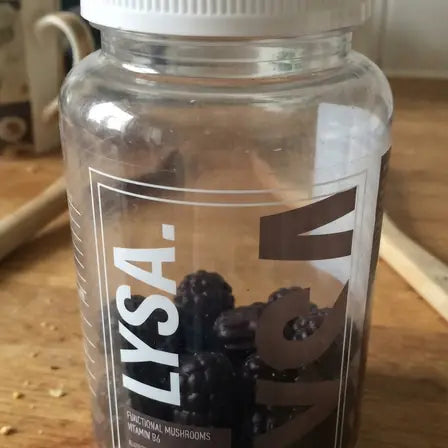 A jar of Lysa Wellness gummies on a kitchen worktop